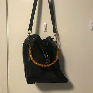 Vintage Gucci bamboo nylon bucket bag in black.